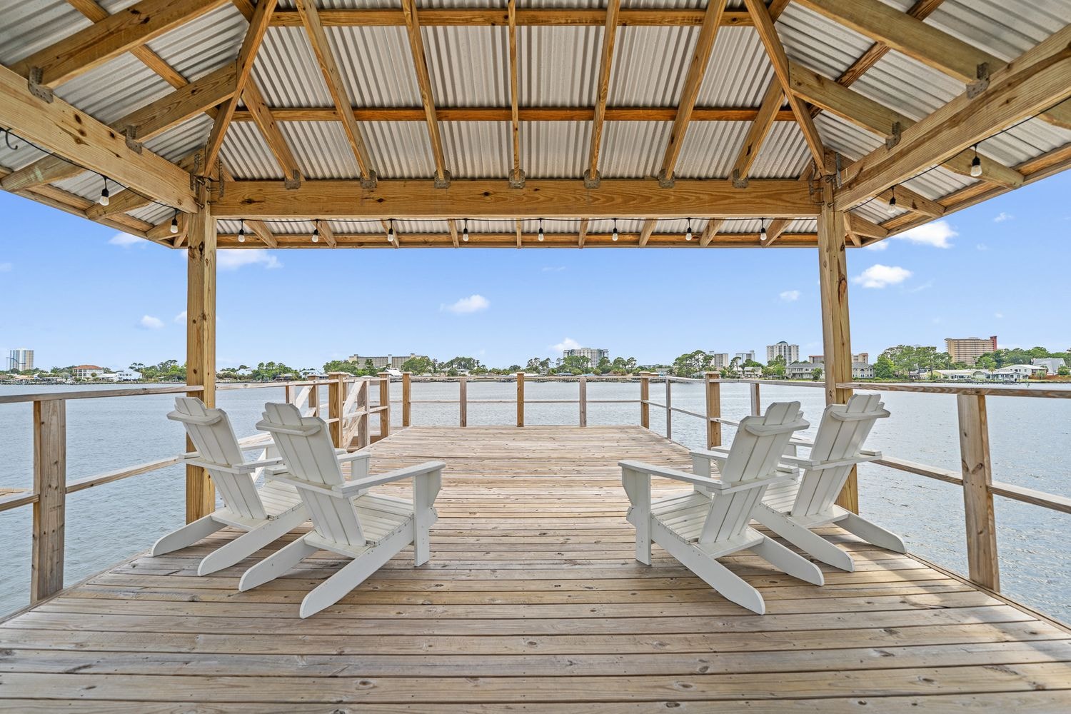 Waterfront dock pavilion with Adirondack chairs