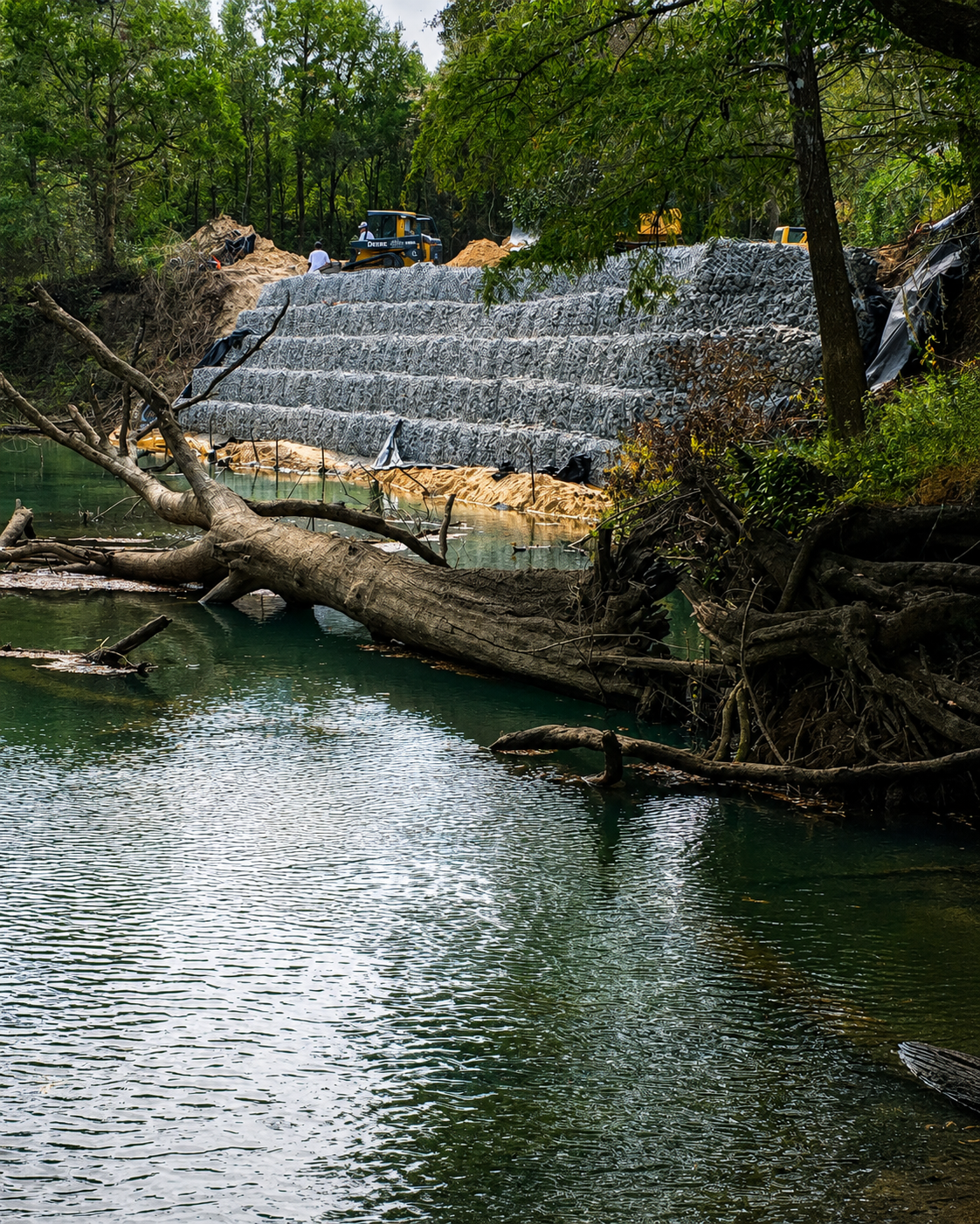 Gabion seawall and retaining wall construction along a river